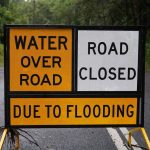 Water over road road closure sign
